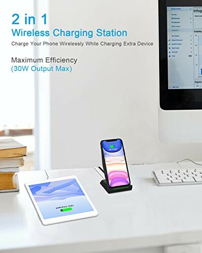 Wireless charging station with phone and tablet on desk.